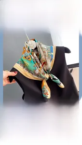 Detail of a vintage mulberry silk square scarf in peacock green and amber on black top
