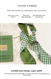 Detail of green and white checkerboard twilly scarf with fine inner stitching craftsmanship