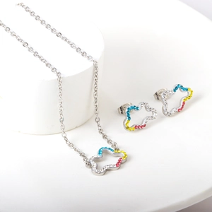 Detailed macro view of silver hollow cloud jewelry set with vibrant multicolored crystals