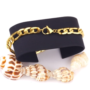 8mm 18K gold plated stainless steel curb chain bracelet on a black display with seashells