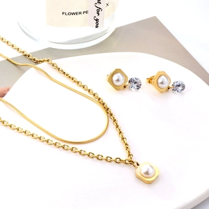 Elegant gold double-layered necklace and pearl drop earrings jewelry set for women