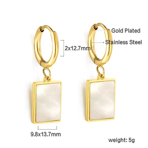 Detailed view of 18K gold plated stainless steel earrings with white shell inlay