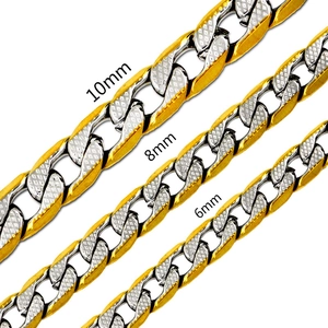 Macro detail of 6mm, 8mm, and 10mm mixed gold and silver Cuban link chains with star texture