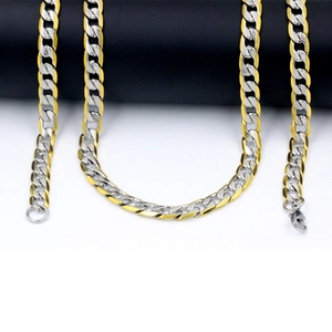 Two-tone gold and silver Cuban link necklace with textured engraving and lobster clasp