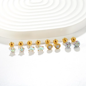Set of four gold stainless steel stud earrings featuring geometric shapes and colorful stones