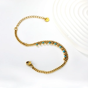 Golden stainless steel bracelet with blue turquoise beads and elegant lobster clasp