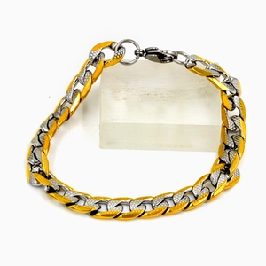 Bracelet à mailles cubaines bicolore argent et or avec texture rugueuse et fermoir