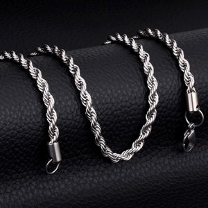 Close-up of silver twist rope chain necklace with lobster clasp on black leather