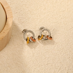 Three-tone roman numeral cutout stud earrings in 18K gold plated stainless steel