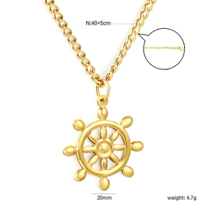 Macro detail of a 20mm golden nautical helm pendant on a 40+5cm adjustable chain