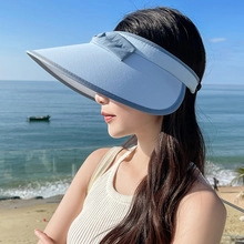 Light blue wide brim sun visor hat for women at the beach with open top design