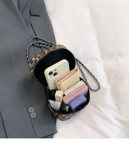 Internal view of leopard print crossbody bag showing ample space for phone and essentials