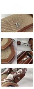 Detailed macro view of high-quality fabric texture, silver metal D logo and scarf handle