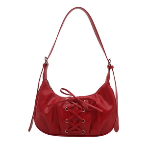 Red crescent shoulder bag with lace-up ribbon design and matte faux leather finish