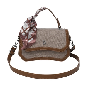 Fashionable contrast color shoulder bag in brown leather and beige twill fabric