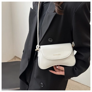Close-up of white leather curved crossbody bag with gold Fashion & Bags lettering detail