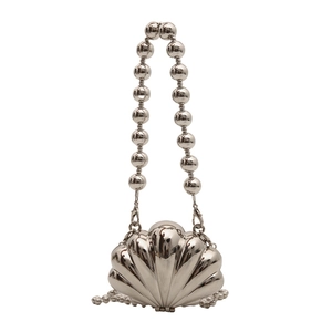 Chic silver shell-shaped mini handbag with pearl handle and shiny metallic finish