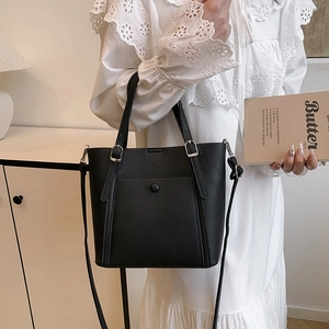 Retro black litchi pattern tote bag with metal buckle and adjustable crossbody strap