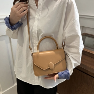 Classic camel faux leather flap handbag with gold oval metal buckle and top handle