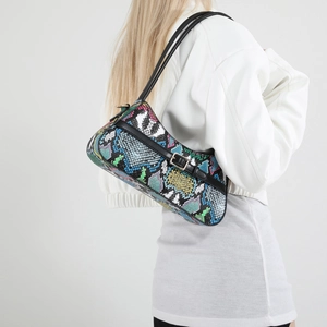 Multicolor snakeskin baguette bag with black straps and silver hardware shown on model