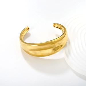 Polished 18K gold-plated stainless steel open bangle bracelet with mirror finish