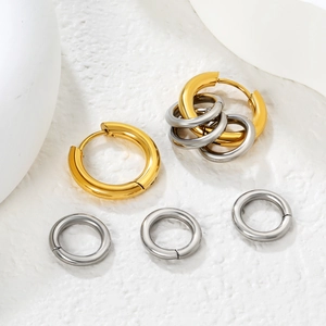 Minimalist geometric C-shaped hoop earrings set in polished gold and silver finish