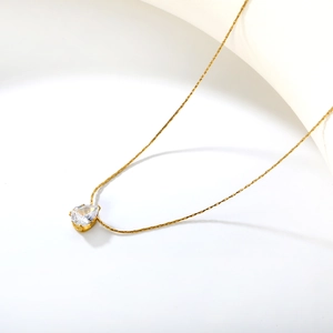 18k gold plated stainless steel necklace with a pear-cut clear gemstone pendant