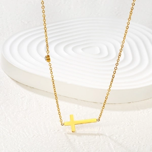 Minimalist gold stainless steel cross necklace with side pendant and white zircon accent
