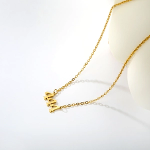 Detailed view of 18k gold plated stainless steel 444 angel number pendant necklace