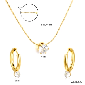 Elegant gold-plated jewelry set featuring round crystal pendant necklace and matching stud earrings