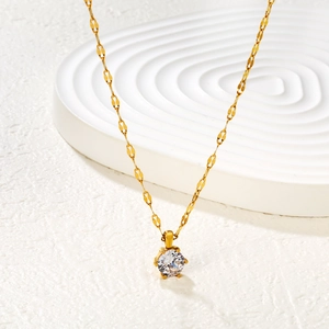 Elegant 18k gold plated necklace with a sparkling round zircon pendant on white background