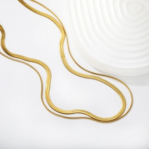 Minimalist 18k gold plated double layered snake chain necklace on white background
