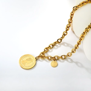 Gold chunky chain necklace featuring double Elizabeth II coin pendants on white art stand