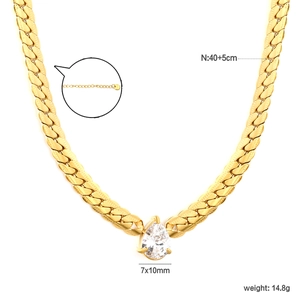 Golden chunky sun pendant necklace with pear-shaped gemstone and stainless steel curb chain