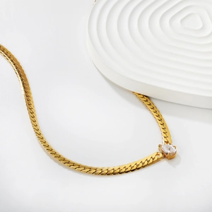 Golden sun hollow necklace with pear-shaped white zircon on flat snake chain