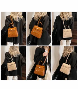 Detail view of vintage flap handbag showing adjustable strap and pebble grain texture