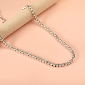 Detail of silver tennis chain with round cubic zirconia and adjustable lobster clasp