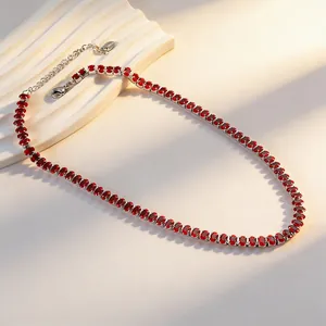 Elegant silver tennis necklace featuring oval red zircons and adjustable lobster clasp