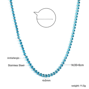 Macro shot of stainless steel tennis chain with blue oval-cut crystals and antiallergic finish