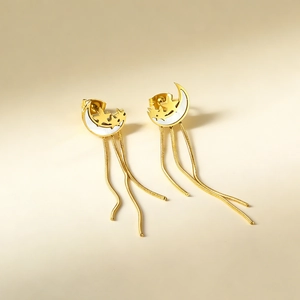 Golden moon and star chain tassel earrings with white enamel inlay for women