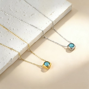 Square pendant necklaces in gold and silver finish with turquoise blue center stones