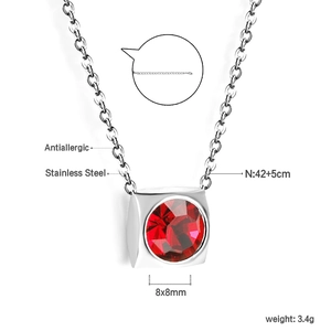 Detail of square 18K gold plated stainless steel necklace with a red crystal pendant