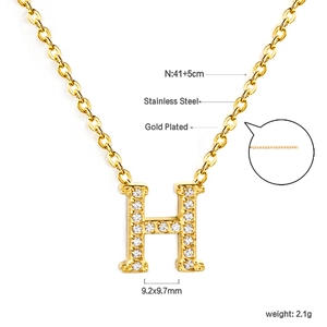 Detailed view of H-letter pendant necklace in gold-plated stainless steel with zircon stones