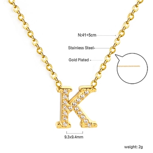 Detail of 18K gold plated stainless steel K-letter pendant with pavé cubic zirconia
