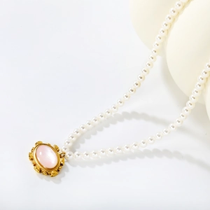Elegant French style pearl necklace with pink shell pendant and gold hardware