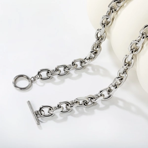 Industrial style thick stainless steel Cuban link necklace with OT buckle on ceramic prop