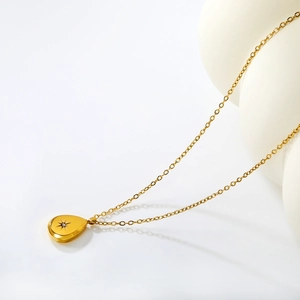 18K gold plated stainless steel teardrop necklace with sparkling starburst pendant