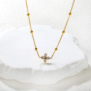 Gold stainless steel beaded necklace with a clear zircon four-leaf clover flower pendant
