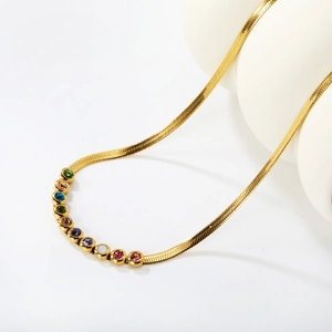 Elegant gold snake chain necklace featuring ten colorful bezel-set zircon gemstones