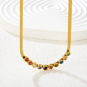 Gold blade snake chain necklace with eleven colorful round zirconia stones in a semi-arc